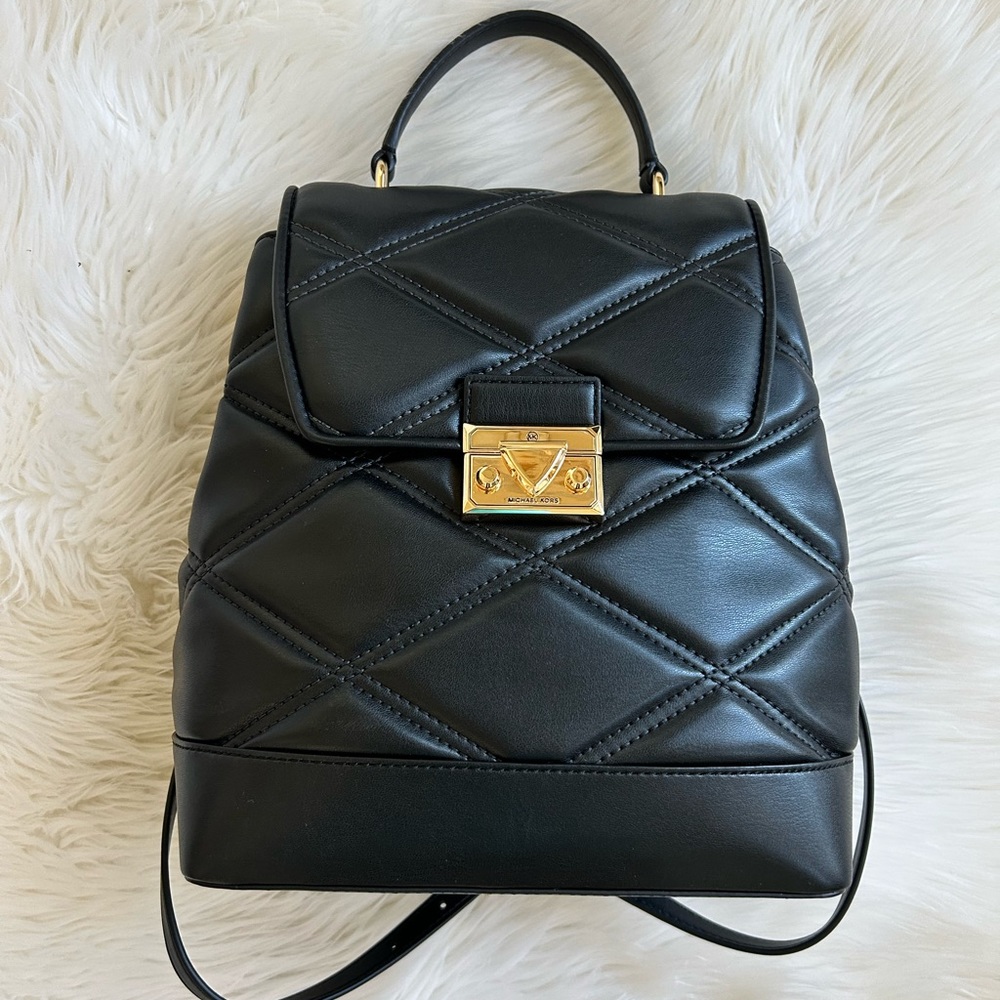 $628 Retail New! Black quilted genuine leather backpack purse